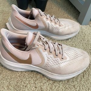 Pink women’s Nike tennis shoes